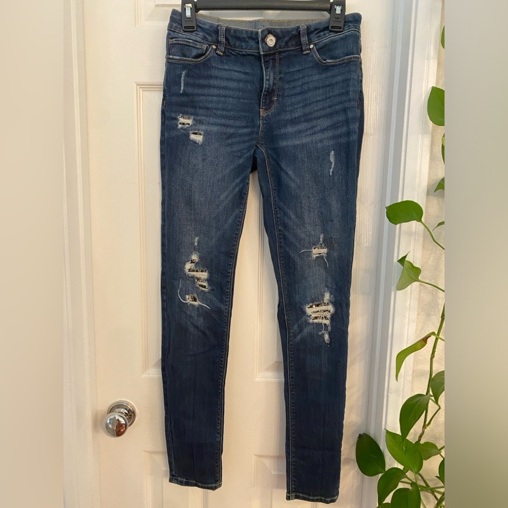 White House Black Market Jeans with sparkle embellishments on the tears